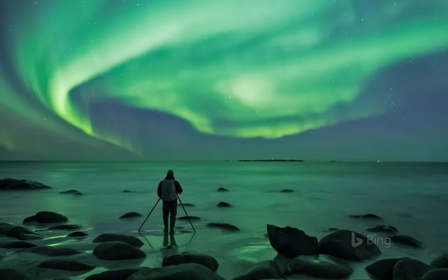 Photographing the aurora borealis at Uttakleiv Beach, Norway