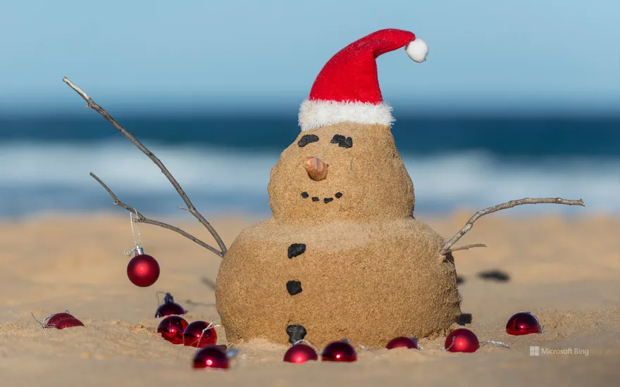 Australian Christmas sandman with decorations on Bondi Beach, NSW