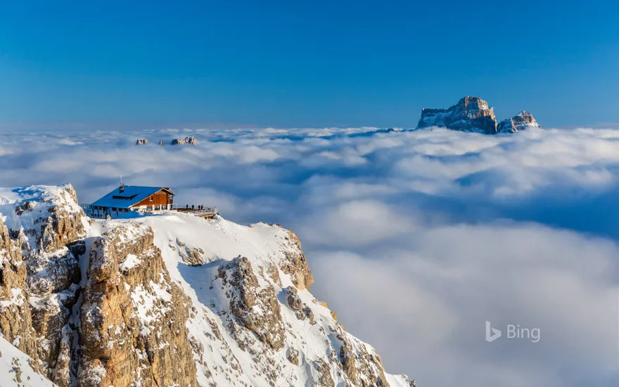Rifugio Lagazuoi above the clouds with Monte Pelmo in the background, Dolomites, Italy