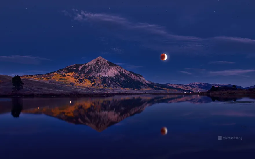 Lunar eclipse above Mount Crested Butte, Colorado, USA