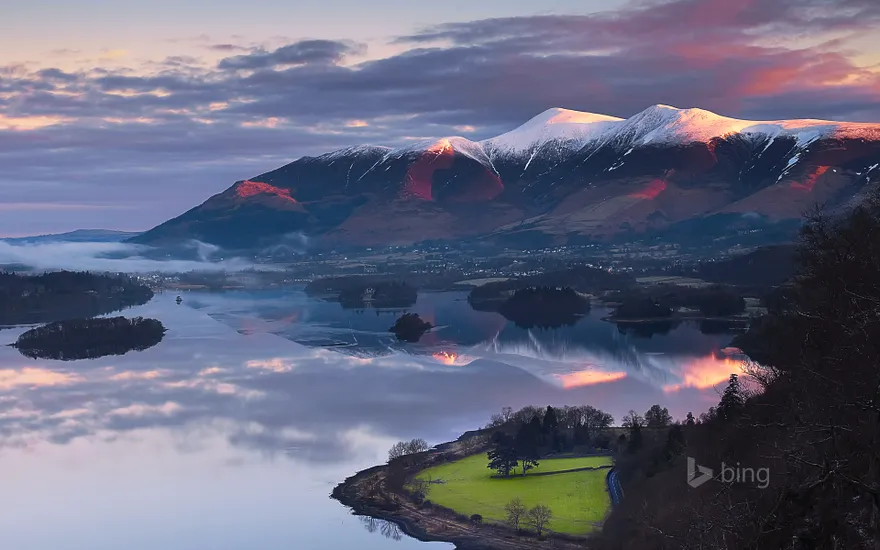 Sun rising over Skiddaw Mountain and Derwentwater in Cumbria, England
