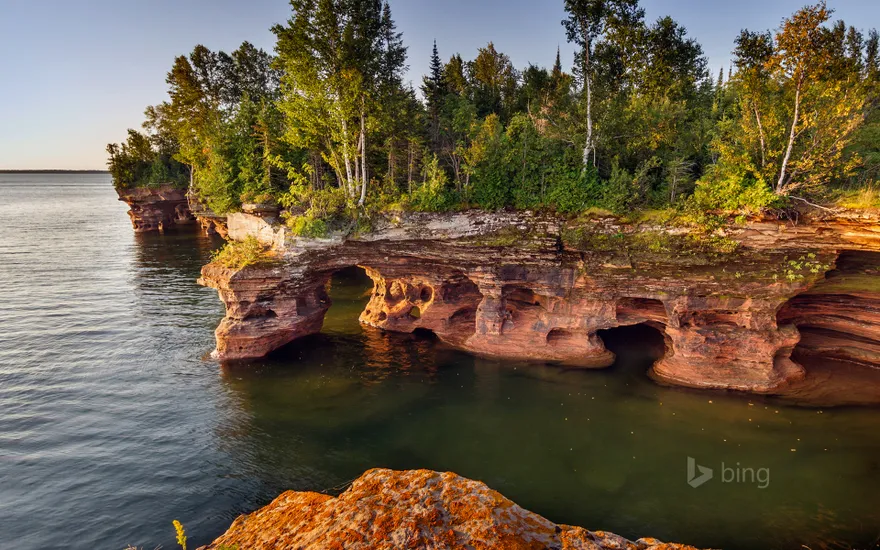 Layered sandstone cliffs and sea caves on Devils Island in the Apostle Islands National Lakeshore, Wisconsin