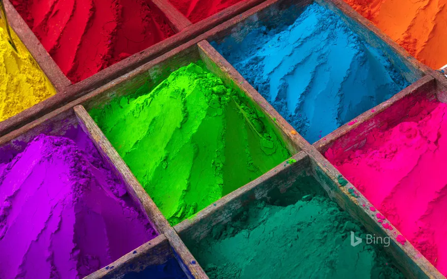 Brightly colored powder for sale during Holi
