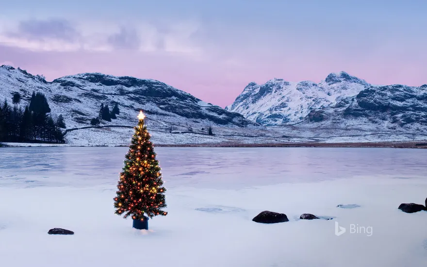 The Langdale Pikes with an illuminated Christmas tree, Lake District National Park