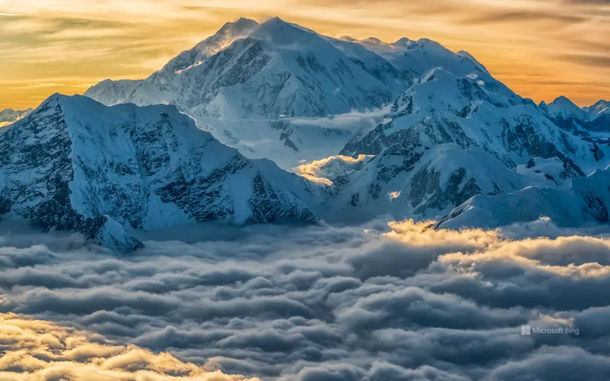 Aerial image of Mount Logan rising above the clouds in Kluane National Park, Yukon