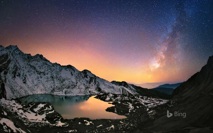 Nepal's Gosaikunda Lake in the Himalayas and the Milky Way above