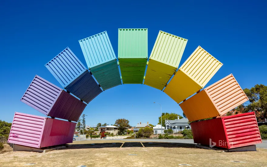 Wide angle view of rainbow-coloured shipping containers in Fremantle, Australia