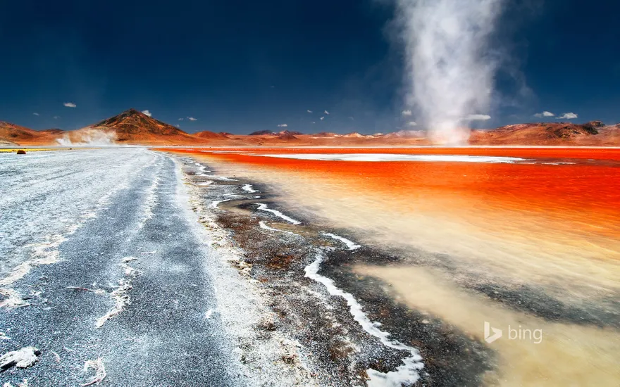 A dust devil swirls across Laguna Colorada in Bolivia