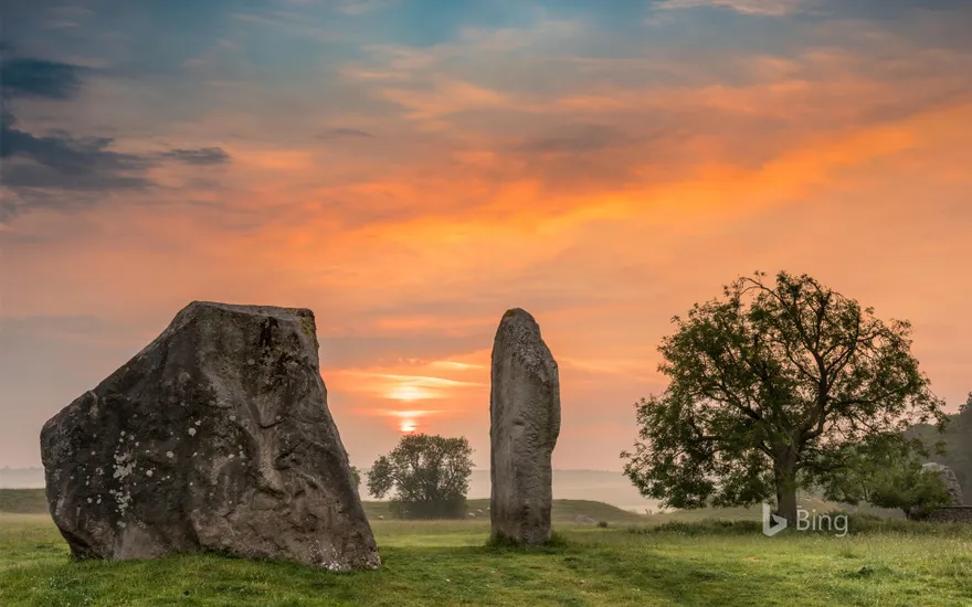 Dawn breaks over the ancient Sarsen Stones at Avebury, Wiltshire, at Summer Solstice