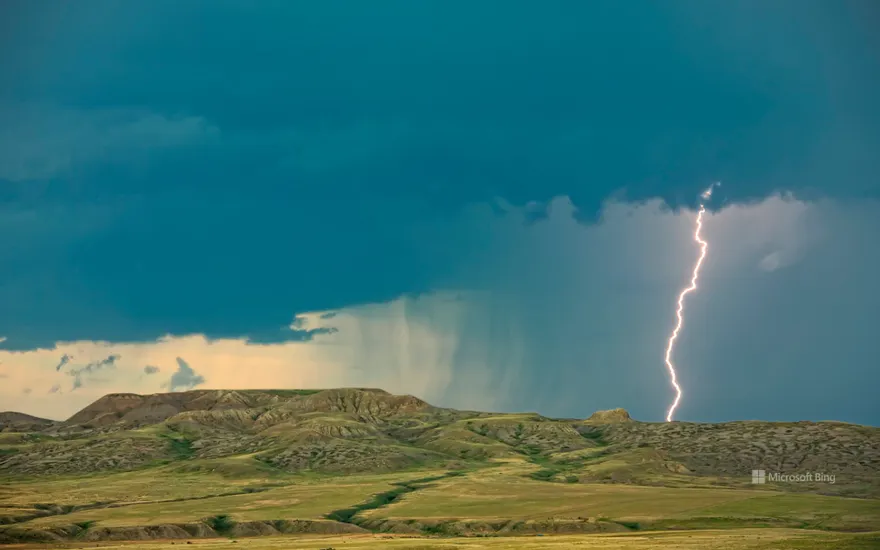 Lightning striking over 70 Mile Butte and Sleeping Lion Butte, Grasslands National Park, Saskatchewan