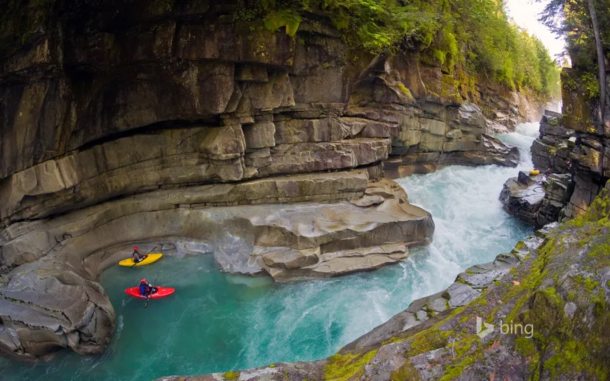 Kayakers in Ashlu Creek near Squamish, British Columbia, Canada