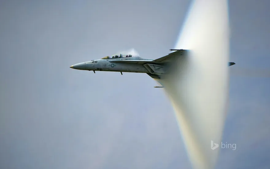 US Navy F/A-18F Super Hornet creating a sonic boom