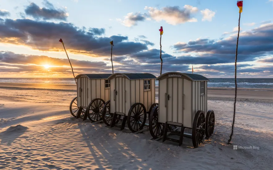 Changing cars on the beach at sunset on the island of Norderney, East Frisia, Lower Saxony